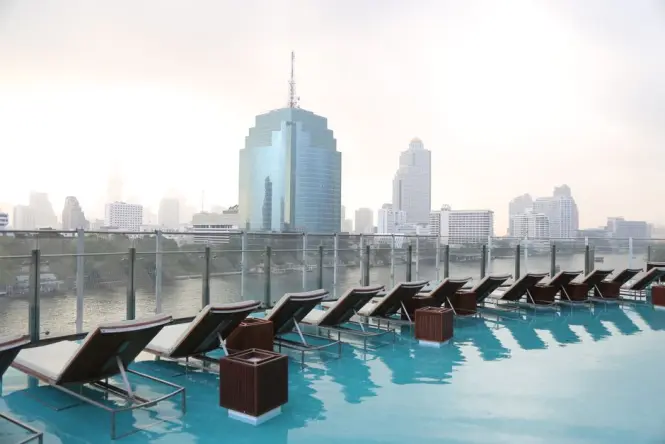 A rooftop pool overlooking the Bangkok skyline