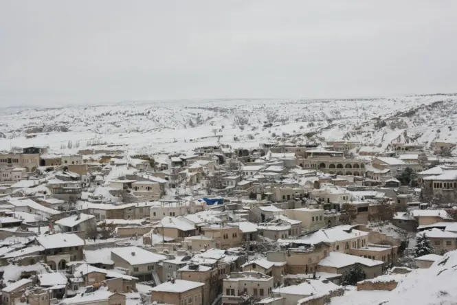 Snow covered fairy chimneys in Cappadocia on a quiet winter morning.