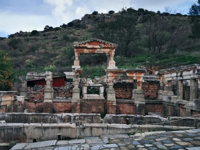 The ancient Library of Celsus at Ephesus standing under a clear blue spring sky.