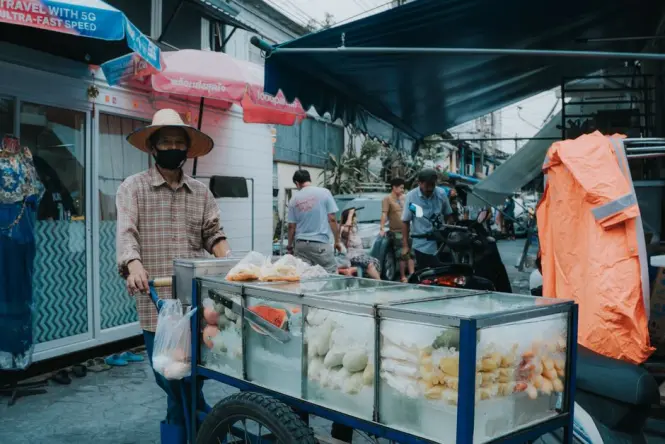 A street food cart serving noodles in Bangkok