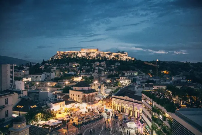 View of the Acropolis at dusk from a nearby terrace