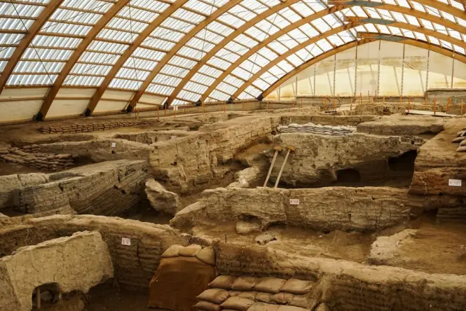 Underground archaeological excavation with stone foundations