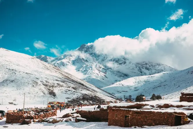 Snow-capped Atlas Mountains visible from Agdal Gardens on a clear winter morning
