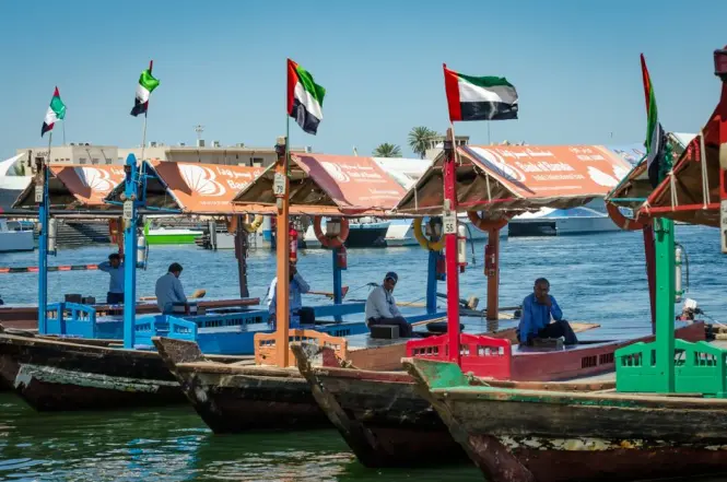 An abra wooden boat crossing the Dubai Creek near Bur Dubai