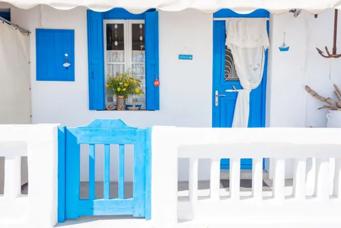 Blue-shuttered whitewashed house typical of Anafiotika's Cycladic architecture