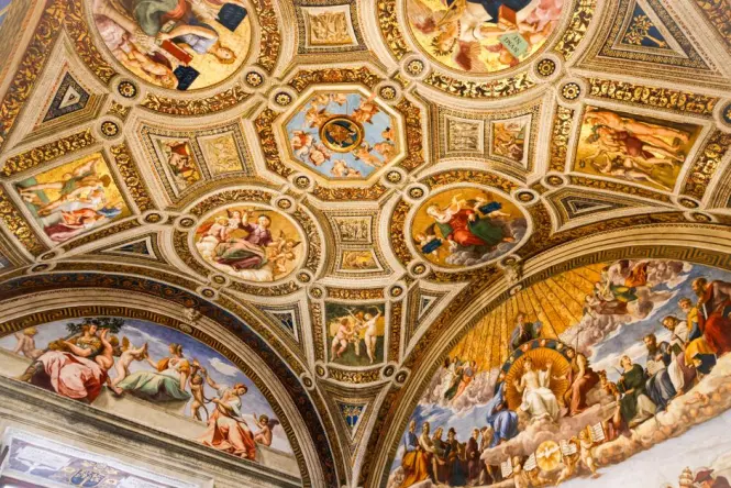 Close-up of medieval heraldic frescoes in the grand staircase