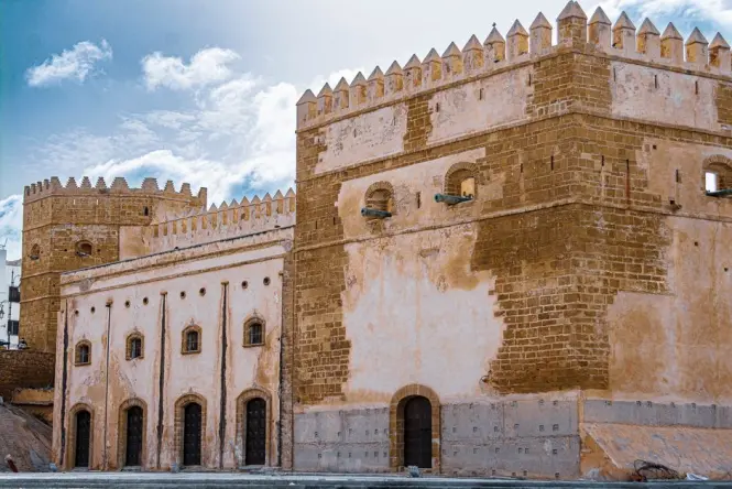 Weathered stone detail on Bab Agnaou reflecting its Almohad-era origins
