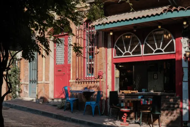 Small cafe with outdoor seating on a colorful street in Balat