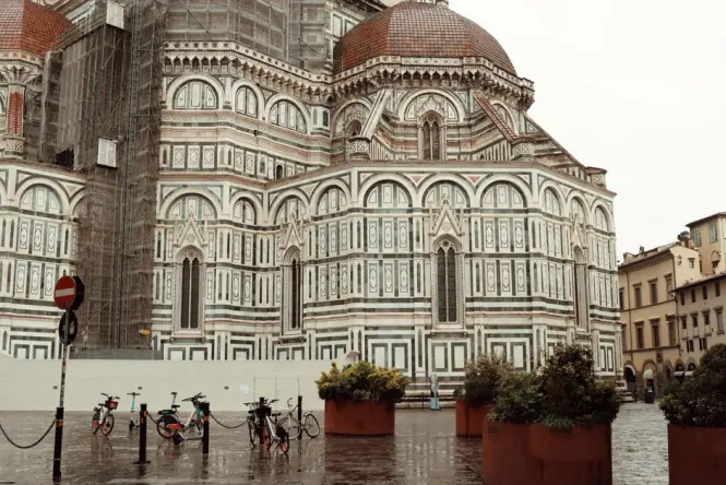 A view of the Florence Duomo from a narrow street showing the contrasts of crowd levels