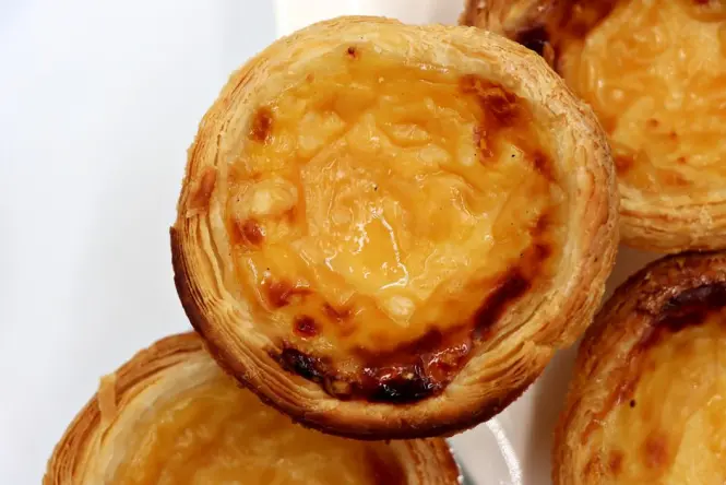 Pastéis de Belém custard tarts on a tray