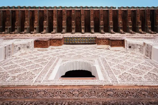 Ticket entrance area at a historic Marrakech madrasa