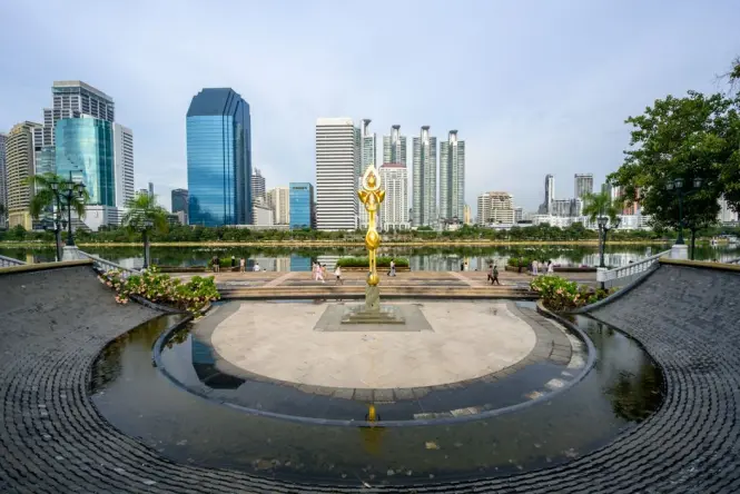 Lake and skyline view inside Benjakitti Park Bangkok