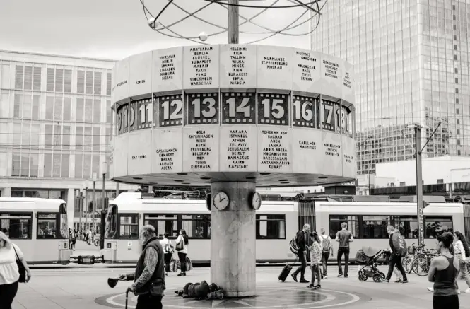 Alexanderplatz station with trams and pedestrians near the TV Tower