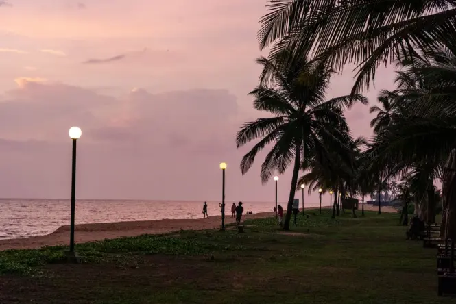Paved beach promenade along the Dubai coastline at sunset