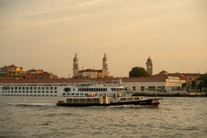 A Venetian vaporetto water bus transporting passengers across the lagoon
