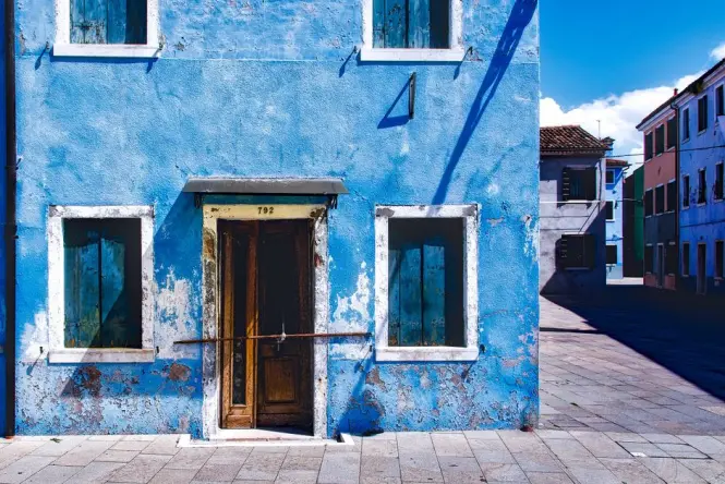 Quiet, empty streets of Burano in the early morning sunlight