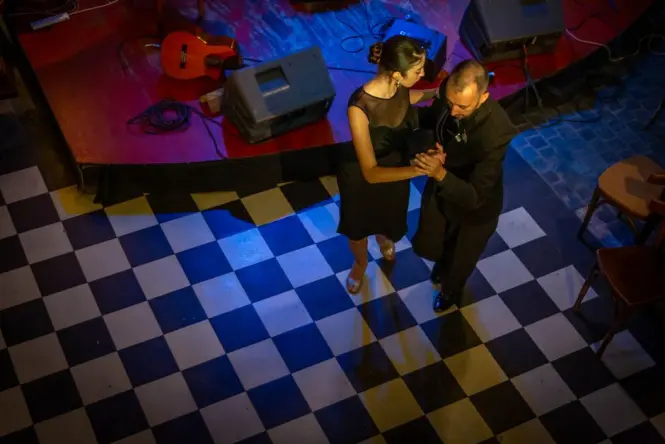 Tango dancers performing on stage during a Buenos Aires show