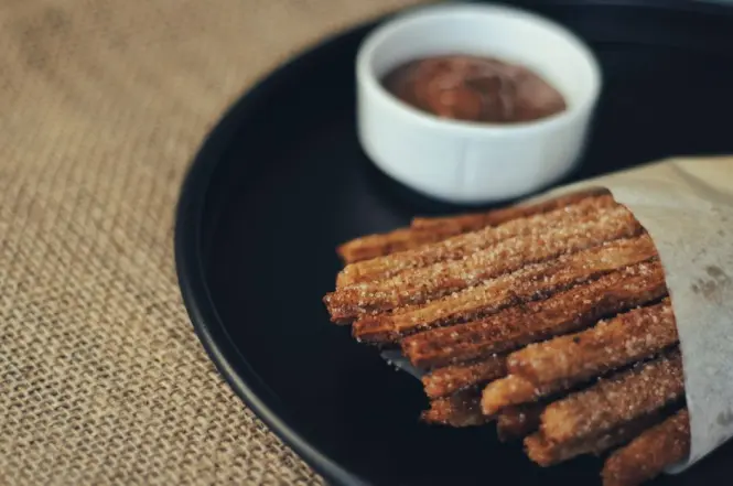 Churros with chocolate dipping sauce served at a Buenos Aires café
