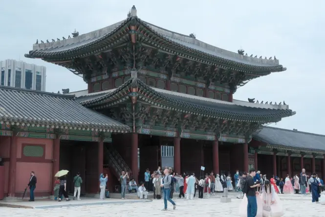 Small group following a guide through the Huwon Secret Garden at Changdeokgung