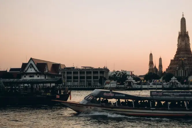 Wat Arun at sunset seen from the Chao Phraya River
