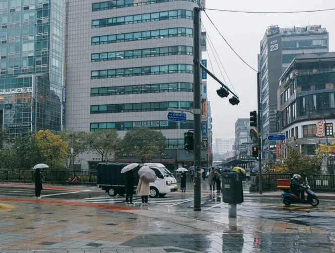Heavy rain falling over the streets of downtown Seoul