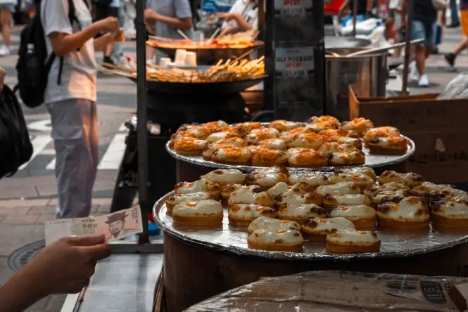 Busy food stalls inside the historic Gwangjang Market in Seoul
