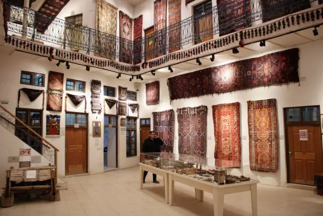 Textile and craft exhibition display inside a Moroccan museum gallery
