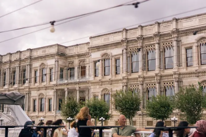 Tour groups gathering outside Dolmabahce Palace on a busy morning