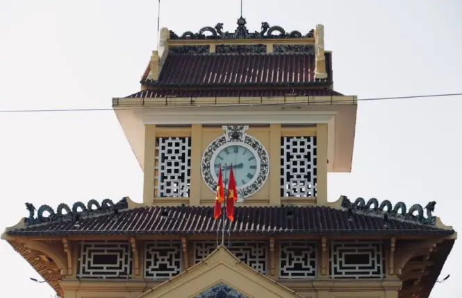 Historic arched facade of Dong Xuan Market building