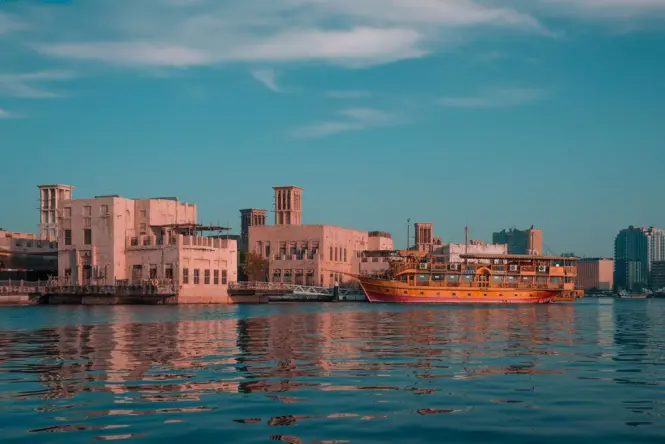 Golden sunset light reflecting on the water of Dubai Creek