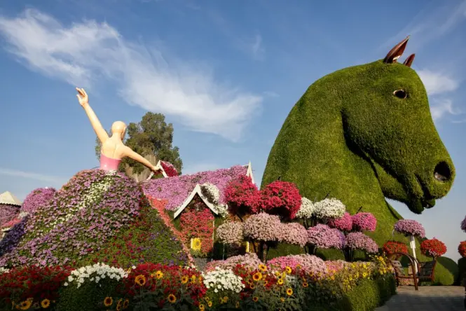 Butterfly-shaped topiary made of flowers at a Dubai garden display