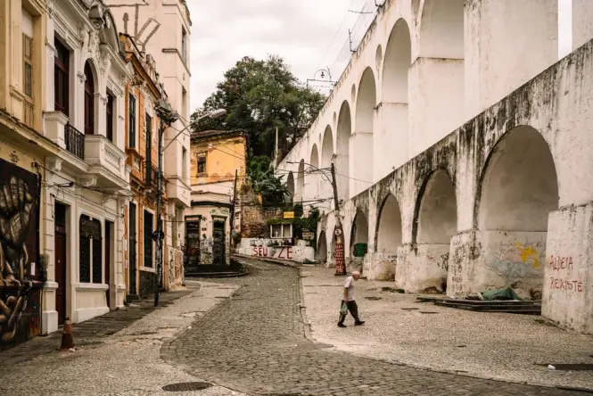 Visitors walking near the Arcos da Lapa close to the Escadaria Selarón entrance
