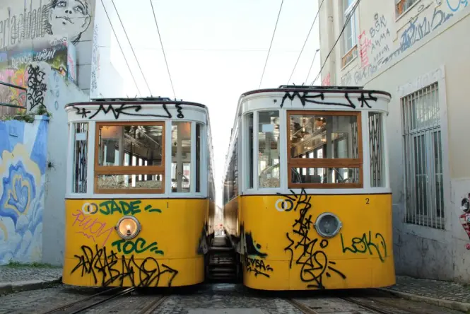 The historic yellow Santa Teresa tram near the top of the Selarón steps