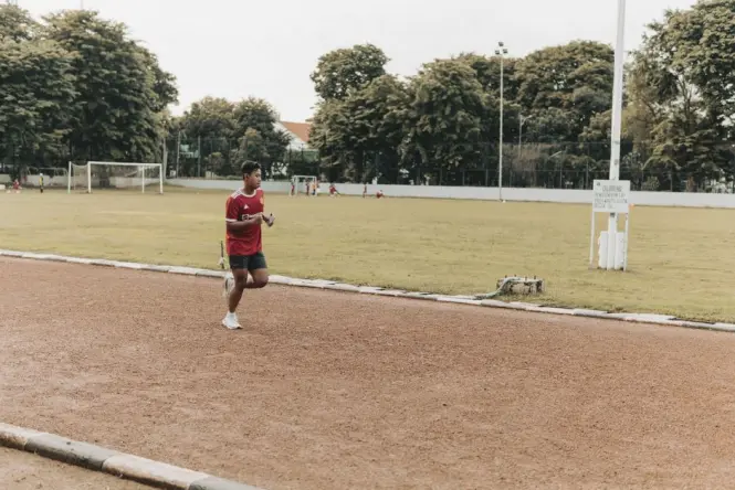 Early morning joggers on a shaded path in Fort Canning Park