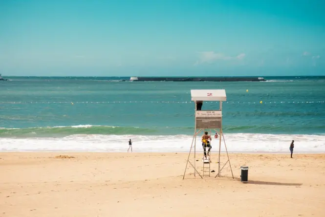 Lifeguard tower standing along the sandy shoreline of Jumeirah Beach