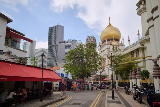 Cafes along Bussorah Street with Sultan Mosque in the background