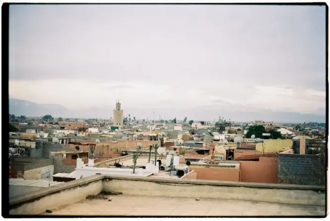 Narrow tower staircase leading to rooftop views over Marrakech medina