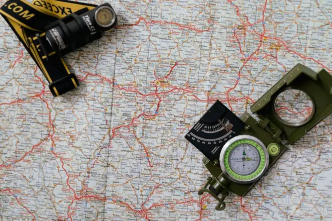 Hiking essentials including water bottle, headlamp, and jacket for Lion's Head