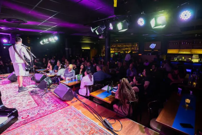 Rooftop bar with live band on Long Street at night