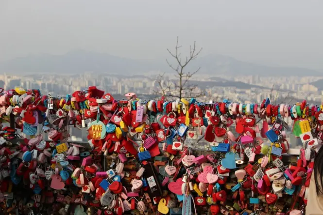 N Seoul Tower on Namsan mountain compared to Lotte World Tower Seoul Sky