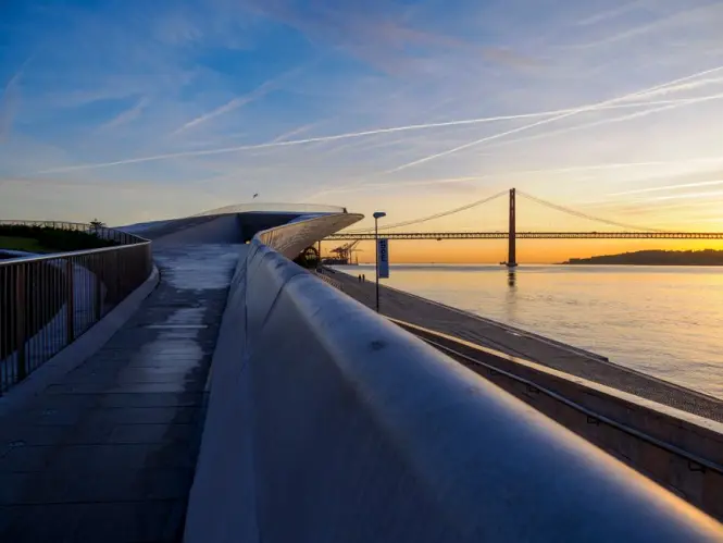 Sunset view from MAAT toward the Tagus and bridge