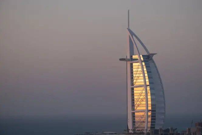 Sunset view of Burj Al Arab from a waterside terrace at Madinat Jumeirah