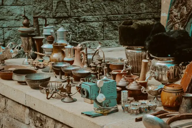 Vintage items displayed at an antiques market stall