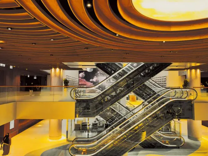 Escalators and levels inside a large shopping complex