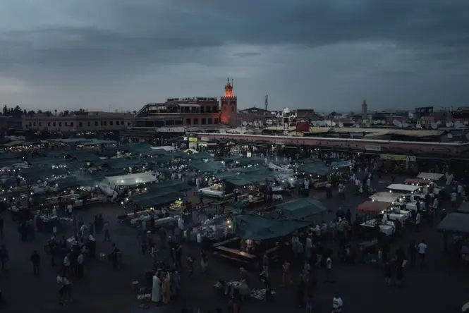Food stalls lit up at night in Jemaa el-Fnaa square