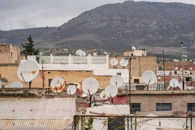 Rooftop terrace of a traditional riad in Mellah with a view toward the Atlas Mountains