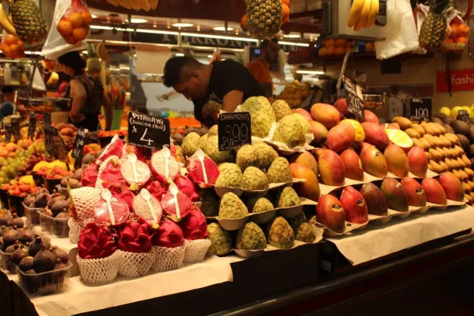 Stacked tropical fruit at La Boqueria market