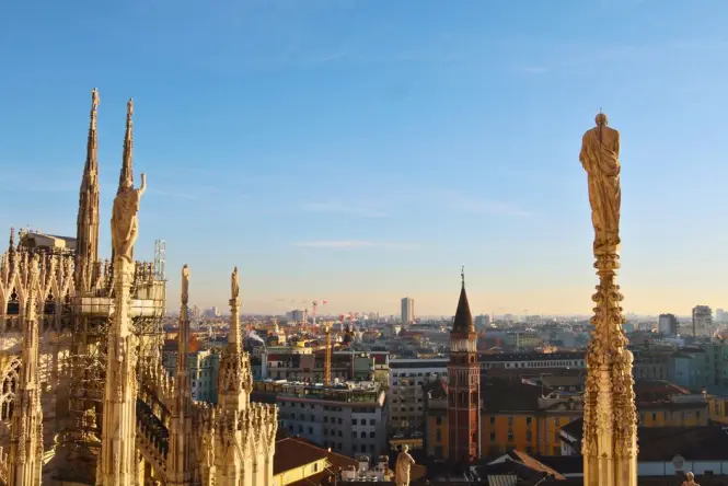 Architectural details of the white marble spires on the Duomo rooftop