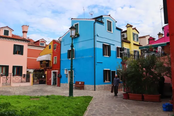 Brightly painted houses along a canal in Burano