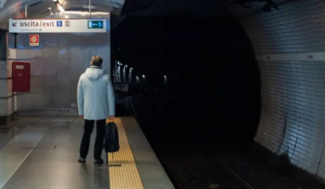 A modern underground metro station platform in Turin